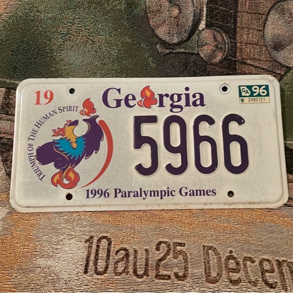 Vintage 1996 Georgia Olympics Paralympic Games State License Plate Blaze Mascot
